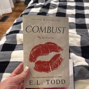 COMBUST by E.L. Todd — Beige Cover with Red Lip Print